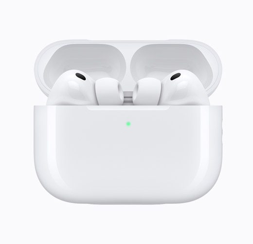 AirPods 4 inside an open white charging case