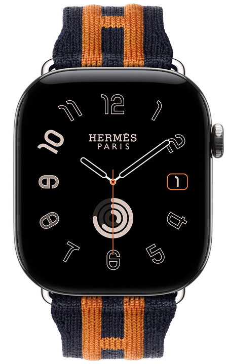 Apple Watch Hermès Series 12, analoges Radial Zifferblatt, (Stunden-, Minuten- und Sekundenzeiger, Komplikationen: Datum, Aktivitätsringe), Titangehäuse, Farbe Silber, rechte Seitenansicht, Digital Crown, erhöhte Seitentaste, kombiniert mit Rocabar Club Armband, Farbe Bleu Nuit/Orange, dunkelblaues Strickgewebe mit erhöhtem orangefarbenem Streifenmuster und dem Hermès H
