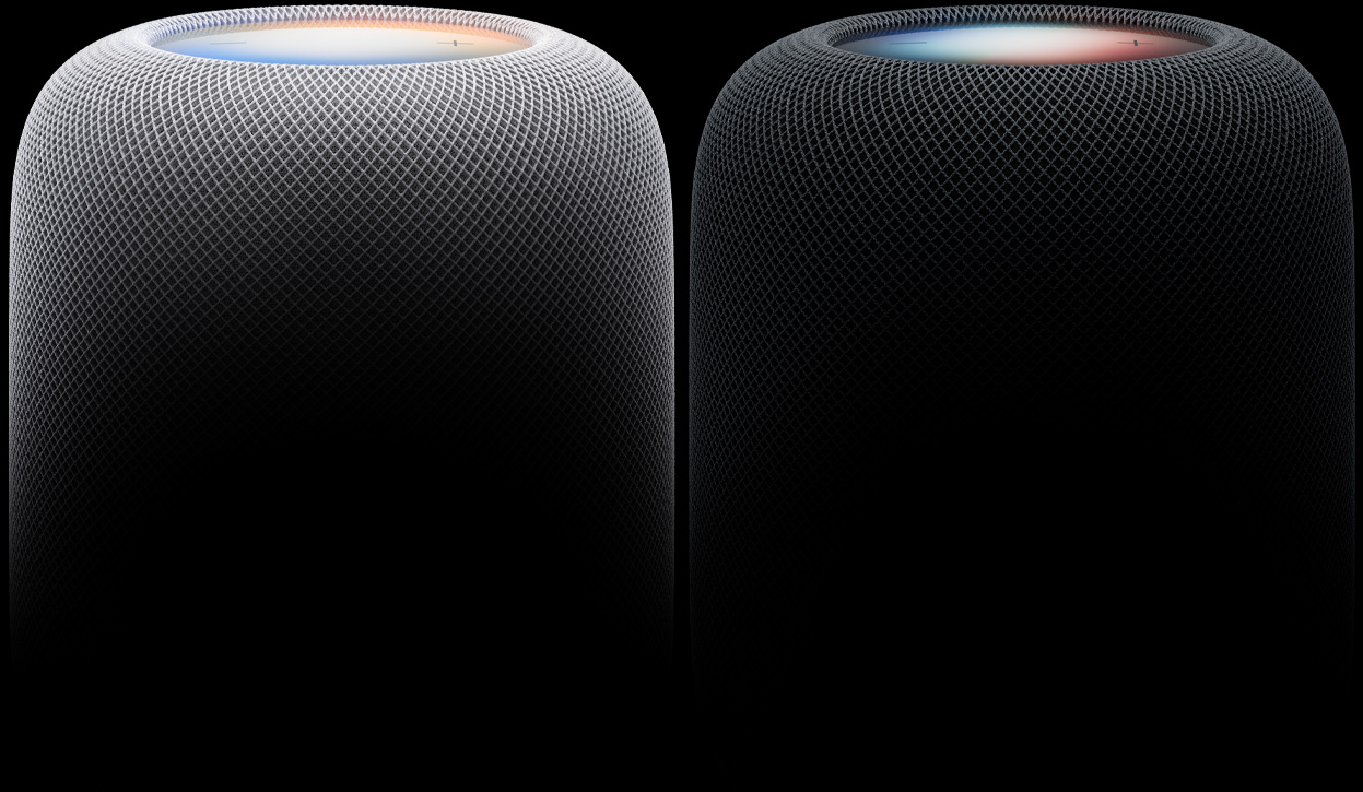 Deux enceintes HomePod côte à côte, coloris blanc et minuit, tissu mesh acoustique tissé, surfaces tactiles illuminées
