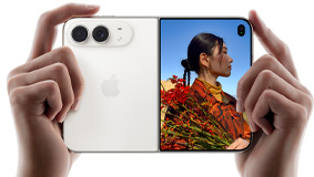 Two hands holding iPhone Duo, Star White color, fully open in landscape position, exterior back panel on the left shows Dual Fusion camera system, outer display on the right shows a portrait photo of a person in front of a blue sky
